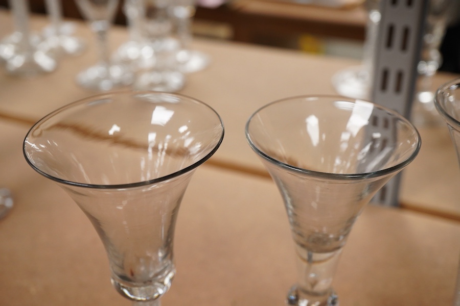 Three 18th century trumpet glasses, two with air twist stems (one with folded foot), together with another with a knopped stem and tear, tallest 16.5cm high